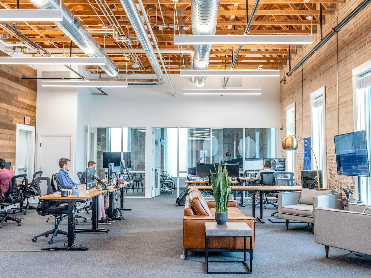 A bright open-plan office in a timber-framed loft